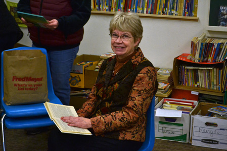 Pam reads a book
